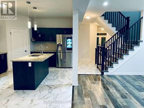London South (South U) apartment for rent - A kitchen with a marble countertop and a staircase with black railings.
