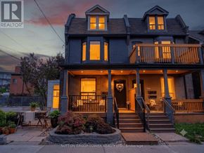 Toronto (Junction Area) apartment for rent - A house with a front porch and a small garden.