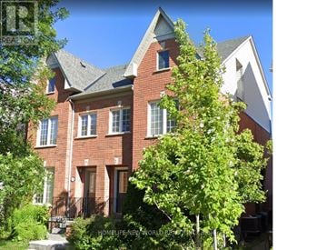 Oakville (Ro River Oaks) apartment for rent - A red brick house with a tree in front.