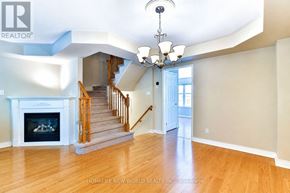 Oakville (Ro River Oaks) apartment for rent - A living room with a fireplace and a staircase.