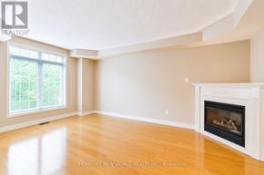 Oakville (Ro River Oaks) apartment for rent - A room with a fireplace and a window.