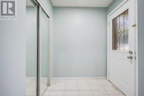 Brampton (Northwood Park) apartment for rent - A white door with a glass panel is on the right and a white wall is on the left.
