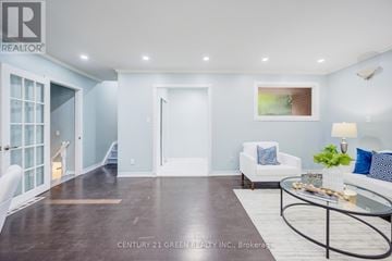 Brampton (Northwood Park) apartment for rent - A living room with a white couch and a glass coffee table.