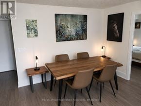 Toronto (Waterfront Communities) condo for rent - A dining room with a wooden table and chairs.