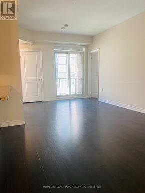 Oakville (Wm Westmount) townhouse for rent - A room with a wooden floor and white walls.