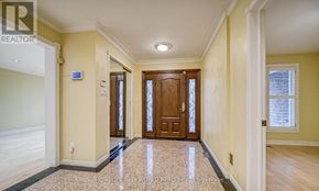 Toronto (Banbury-Don Mills) apartment for rent - A hallway with a tiled floor and wooden doors.