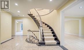 Toronto (Banbury-Don Mills) apartment for rent - A spacious foyer with a curved staircase and a polished floor.