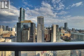 Toronto (Bay Street Corridor) condo for rent - A cityscape with tall buildings and a clear sky.