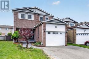 Ajax (Central) apartment for rent - A two-story house with a garage and a driveway in front.