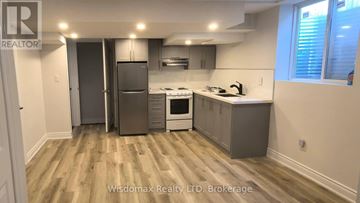 Niagara Falls (Forestview) apartment for rent - A kitchen with wooden floors and modern appliances.