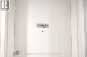 Waterloo condo for rent - A white door with a unit number 605 on it.