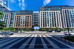 Vaughan condo for rent - A street view of a city with buildings, cars, and a fire hydrant.