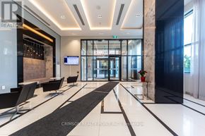 Vaughan condo for rent - A modern office lobby with a black and white color scheme.