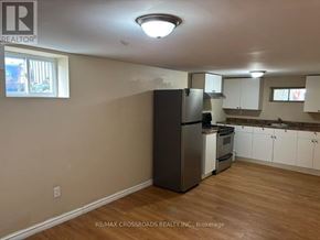 Aurora (Aurora Highlands) apartment for rent - A kitchen with a refrigerator, oven, and cabinets.