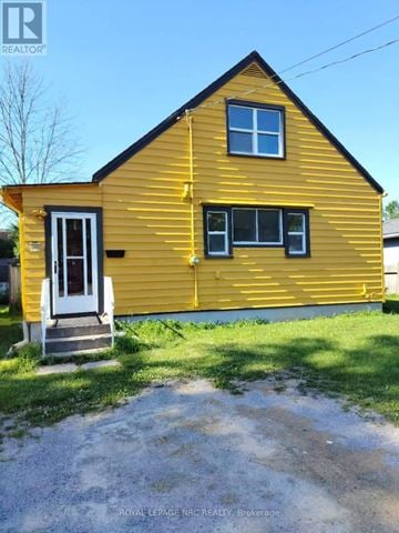 Niagara Falls (Arad/Fallsview) apartment for rent - A yellow house with a white door and windows is for sale.