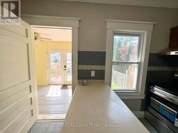 St. Catharines (E. Chester) apartment for rent - A kitchen with a stove top oven and a window.