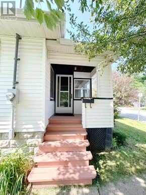 St. Catharines (E. Chester) apartment for rent - A white house with a black door and a glass window.