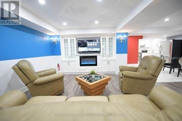 Richmond Hill (Devonsleigh) apartment for rent - A living room with a brown leather couch and a wooden coffee table.