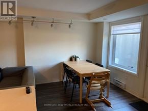 Toronto (Downsview-Roding-Cfb) townhouse for rent - A room with a table and chairs in it.