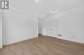 Georgian Bay (Baxter) house for rent - A room with wooden flooring and white walls.