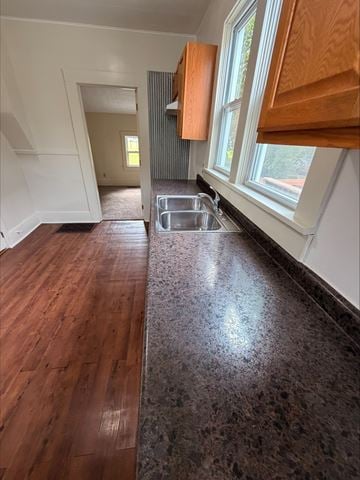 Lima apartment for rent - A kitchen with a sink and wooden floors.