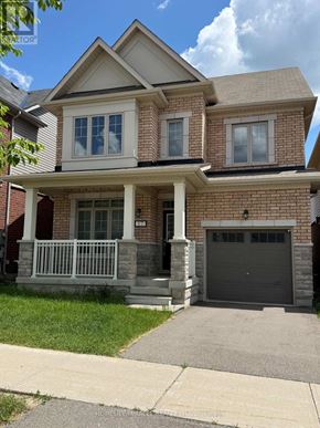 New Tecumseth (Tottenham) apartment for rent - A two-story house with a garage and a front porch.