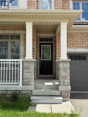 New Tecumseth (Tottenham) apartment for rent - A house with a black front door and a white porch.