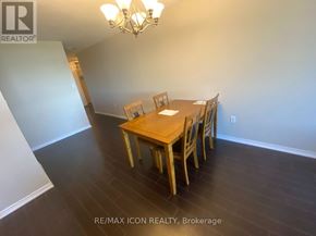 London East (East F) condo for rent - A dining room with a wooden table and chairs.