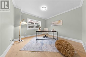 Ottawa apartment for rent - A living room with a leopard print bean bag chair and a blue rug.