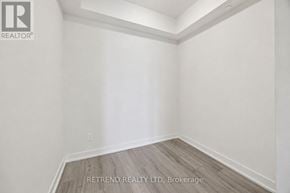 Toronto (Willowdale West) condo for rent - A room with white walls and wooden flooring, with the logo of RETREND REALTY LTD, Brokerage on the bottom right.