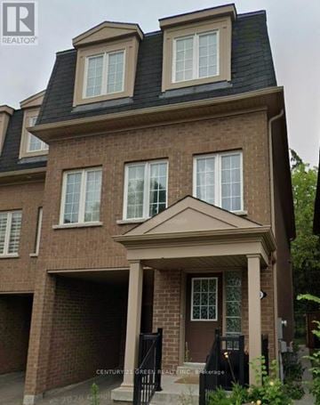 Toronto (Scarborough Village) apartment for rent - A brick house with a black roof and a white window.