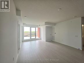 Toronto (Humber Heights) condo for rent - A spacious room with a sliding glass door leading to a balcony.