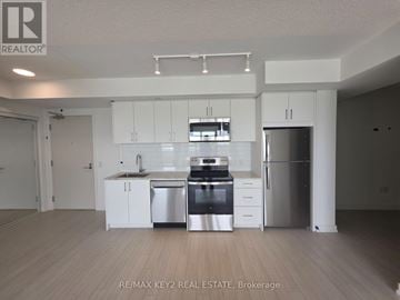 Toronto (Humber Heights) condo for rent - A kitchen with white cabinets and stainless steel appliances.