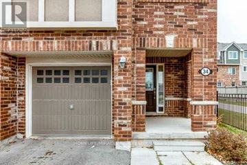 Brampton (Northwest Brampton) townhouse for rent - A brick house with a number 34 on the top right corner.