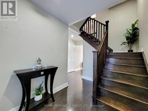 Brampton (Northwest Brampton) townhouse for rent - A staircase in a home with a table and a potted plant.