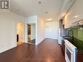 Toronto (Bayview Village) condo for rent - A kitchen area with a stove top oven and a sink.