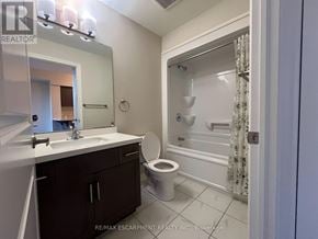 Milton (Be Beaty) condo for rent - A bathroom with a toilet, sink, and shower.