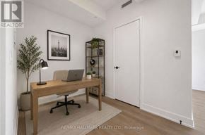 Toronto (Church-Yonge Corridor) condo for rent - A room with a desk, chair, and a plant.