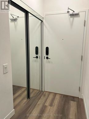 Richmond Hill (Langstaff) condo for rent - A white door with a black handle and a glass panel.