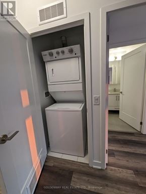 Richmond Hill (Langstaff) condo for rent - A white oven and dishwasher are built into a wall in a kitchen.