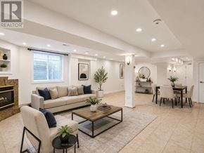 Vaughan (Maple) apartment for rent - A living room with a fireplace, a sofa, a coffee table, and a dining table.