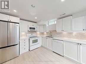 Vaughan (Maple) apartment for rent - A modern kitchen with white cabinets and stainless steel appliances.