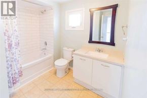 Ajax (Central) apartment for rent - A small bathroom with a toilet, sink, and shower.