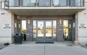 Milton (Om Old Milton) condo for rent - The front of a building with a glass door entrance.