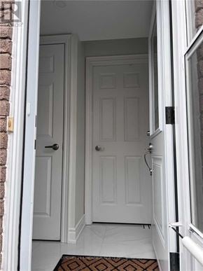 Toronto (Milliken) apartment for rent - A white door is in a white hallway.