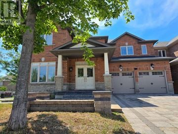Richmond Hill (Jefferson) apartment for rent - A house with a brick facade and a white door is surrounded by a well-maintained lawn.