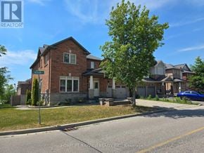 Richmond Hill (Jefferson) apartment for rent - A brick house with a tree in front of it.