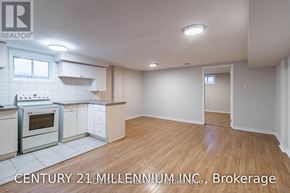 Brampton (Brampton South) apartment for rent - A kitchen with white cabinets and a stove top oven.
