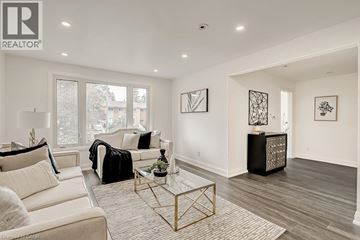 Waterloo apartment for rent - A living room with a white couch and a glass coffee table.