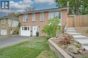 Waterloo apartment for rent - A house with a white door and a small front yard.